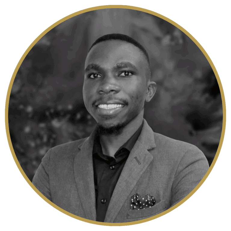 Smiling Black man, Alex, in a grey suit jacket, black shirt, and polka dot pocket square, in a gold-bordered circle.