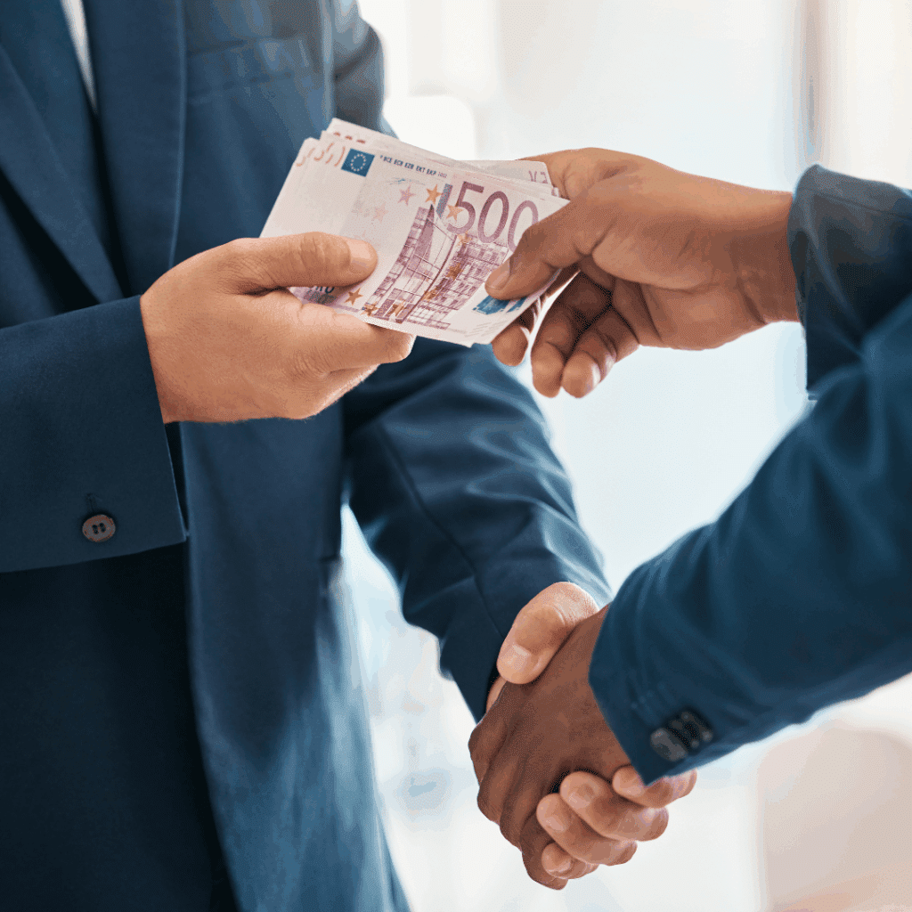 Business handshake and euro banknotes representing SARB transfer rules abroad and cross-border income movement